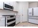 Eat-in kitchen featuring modern appliances, including a range and double oven at 2665 Piroli St, Henderson, NV 89044