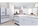 Modern kitchen with white cabinets, stainless steel appliances, and a large island at 2665 Piroli St, Henderson, NV 89044