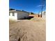 Wide-open backyard area adjacent to the house, offering potential for custom landscaping and design at 2705 Howard Dr, Las Vegas, NV 89104