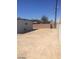 Wide-open backyard with a block fence, offering potential for landscaping or additional construction at 2705 Howard Dr, Las Vegas, NV 89104