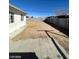 Large backyard space with concrete patio and block fence, offering privacy and potential for outdoor activities at 2705 Howard Dr, Las Vegas, NV 89104