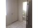 Bathroom featuring tile flooring, light walls, and a toilet in the interior at 2705 Howard Dr, Las Vegas, NV 89104
