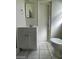 Bathroom featuring vanity with sink, toilet, and updated flooring at 2705 Howard Dr, Las Vegas, NV 89104