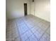 Bedroom with large closet, tiled floors, and a bright, neutral color scheme at 2705 Howard Dr, Las Vegas, NV 89104