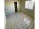 Neutrally painted bedroom featuring closet space and tile flooring at 2705 Howard Dr, Las Vegas, NV 89104