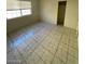 Cozy bedroom with a window and closet space, enhanced by tile flooring at 2705 Howard Dr, Las Vegas, NV 89104