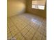 Bright bedroom featuring tile flooring and a window that provides natural light at 2705 Howard Dr, Las Vegas, NV 89104