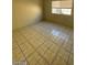 Bedroom showcasing tile flooring, light walls, and natural light from a window at 2705 Howard Dr, Las Vegas, NV 89104