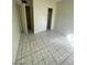 Bedroom featuring tiled floors and a closet with sliding doors at 2705 Howard Dr, Las Vegas, NV 89104