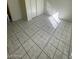 Neutrally painted bedroom featuring closet space and tile flooring at 2705 Howard Dr, Las Vegas, NV 89104
