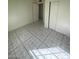Neutrally painted bedroom featuring closet space and tile flooring at 2705 Howard Dr, Las Vegas, NV 89104