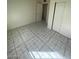 Bedroom showcasing tile flooring, light walls, and closet at 2705 Howard Dr, Las Vegas, NV 89104