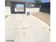 Spacious driveway and open carport connecting to a single-story home with ample parking at 2705 Howard Dr, Las Vegas, NV 89104