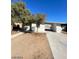 Single-story home featuring an open carport and a gravel front yard, creating a minimalist aesthetic at 2705 Howard Dr, Las Vegas, NV 89104