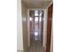 Hallway showcasing tile floors, light walls, and access to multiple rooms at 2705 Howard Dr, Las Vegas, NV 89104