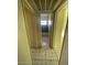 Hallway showcasing tile floors, light walls, and access to a bathroom at 2705 Howard Dr, Las Vegas, NV 89104