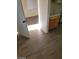 Hallway with wood-look floors connecting to kitchen area at 2705 Howard Dr, Las Vegas, NV 89104