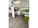 The kitchen has open space with nice flooring, overhead lighting, green cabinets, and a refrigerator at 2705 Howard Dr, Las Vegas, NV 89104