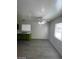 This kitchen has natural lighting, green cabinets, and gray floors at 2705 Howard Dr, Las Vegas, NV 89104