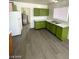 Bright kitchen showcasing wood and green cabinets, modern vinyl floors and updated appliances at 2705 Howard Dr, Las Vegas, NV 89104