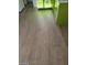 Updated vinyl floors complement the bright green cabinetry in this kitchen space at 2705 Howard Dr, Las Vegas, NV 89104