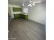 This kitchen has gray flooring, nice natural lighting, and green cabinets at 2705 Howard Dr, Las Vegas, NV 89104