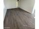 Open concept living room features new gray wood-look flooring at 2705 Howard Dr, Las Vegas, NV 89104