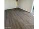 Bright and airy living room featuring new gray wood-look flooring at 2705 Howard Dr, Las Vegas, NV 89104
