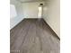 Spacious living room showcasing new gray wood-look flooring at 2705 Howard Dr, Las Vegas, NV 89104