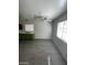 Open living room features modern ceiling fan and updated kitchen with bright green cabinets at 2705 Howard Dr, Las Vegas, NV 89104