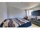 A tidy bedroom featuring neutral walls, a sizable window, and a comfortable bed at 3212 Osage Ave, Las Vegas, NV 89101
