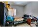 A cozy bedroom featuring a bed, side table, and ample storage space at 3212 Osage Ave, Las Vegas, NV 89101