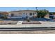 Modest single-story home with low maintenance front yard and ample driveway space at 3212 Osage Ave, Las Vegas, NV 89101