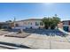 Modest single-story home with low maintenance front yard and ample driveway space at 3212 Osage Ave, Las Vegas, NV 89101