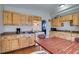 This spacious kitchen has plenty of wood cabinet storage and an eat-in dining area at 3212 Osage Ave, Las Vegas, NV 89101