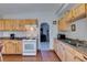 This kitchen features an open layout, wood cabinetry, and access to the living spaces at 3212 Osage Ave, Las Vegas, NV 89101