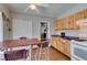 Functional kitchen with tile flooring, light wood cabinets, and modern appliances for cooking ease at 3212 Osage Ave, Las Vegas, NV 89101