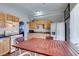 The kitchen provides light wood cabinets, an eat-in dining table, and updated appliances at 3212 Osage Ave, Las Vegas, NV 89101