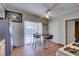 Traditional kitchen features tile flooring, stainless fridge, and an eat-in dining table at 3212 Osage Ave, Las Vegas, NV 89101