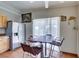 Cozy kitchen with a stainless steel refrigerator and eat-in dining area near natural light at 3212 Osage Ave, Las Vegas, NV 89101