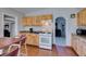 Well-lit kitchen includes gas stove and open access to adjoining room with arched doorway at 3212 Osage Ave, Las Vegas, NV 89101