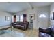 Spacious living room with tile flooring, natural light, and comfortable seating at 3212 Osage Ave, Las Vegas, NV 89101