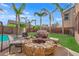 Backyard seating area featuring a gas grill, furniture, and a fire pit at 3213 Salutare Ct, North Las Vegas, NV 89031