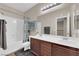 Bathroom with dual sinks, shower-tub combo, and great lighting at 3213 Salutare Ct, North Las Vegas, NV 89031