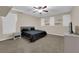 This bedroom features neutral walls, a ceiling fan, carpeted floors, and floating shelves at 3213 Salutare Ct, North Las Vegas, NV 89031