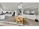 Open-concept dining area with modern lighting, neutral paint, and views to the kitchen at 3213 Salutare Ct, North Las Vegas, NV 89031