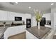 Kitchen with granite countertops, stainless steel appliances, white cabinetry, and kitchen island at 3213 Salutare Ct, North Las Vegas, NV 89031