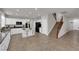 Open kitchen with granite countertops, stainless steel appliances, and an island with barstool seating at 3213 Salutare Ct, North Las Vegas, NV 89031