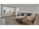 Spacious living room featuring modern décor, comfortable seating, and plush carpeting at 3213 Salutare Ct, North Las Vegas, NV 89031