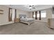 Spacious main bedroom with carpet, neutral walls, ceiling fan, and ensuite bathroom at 3213 Salutare Ct, North Las Vegas, NV 89031